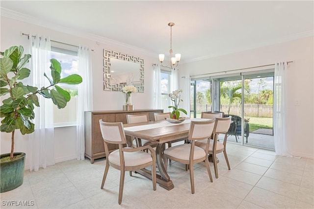 dining space featuring crown molding, light tile patterned floors, and a notable chandelier