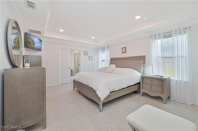 bedroom featuring crown molding, a raised ceiling, and light tile patterned flooring