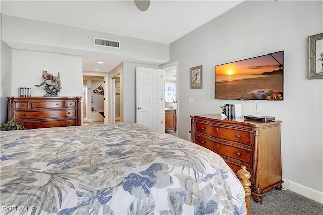 bedroom featuring connected bathroom, ceiling fan, and carpet