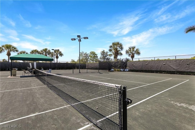 view of sport court with fence