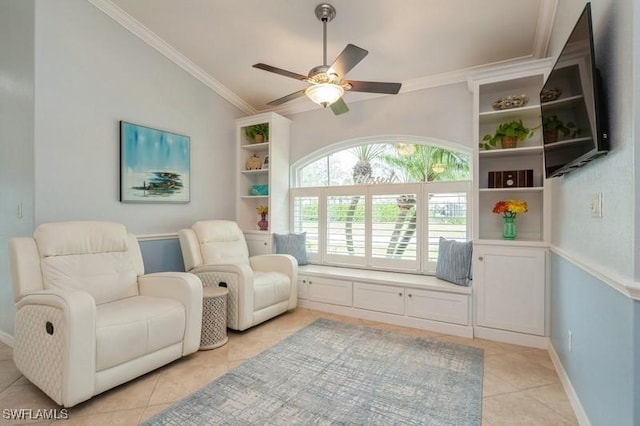 living area with lofted ceiling, light tile patterned flooring, a ceiling fan, baseboards, and ornamental molding