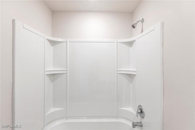 bathroom with shower / washtub combination