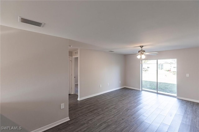 unfurnished room with ceiling fan and dark hardwood / wood-style flooring