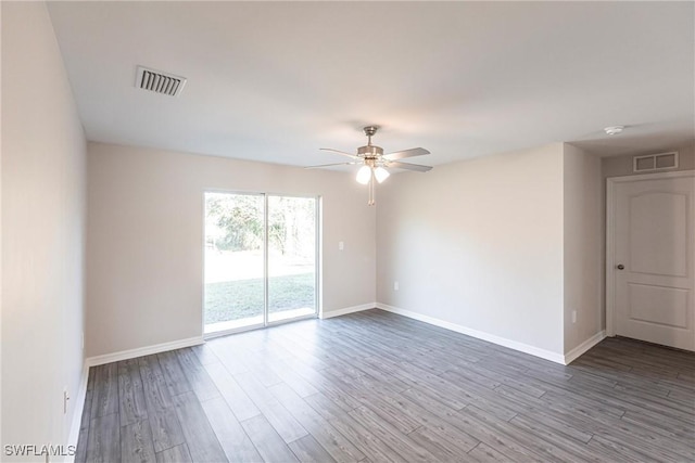 unfurnished room with hardwood / wood-style floors and ceiling fan