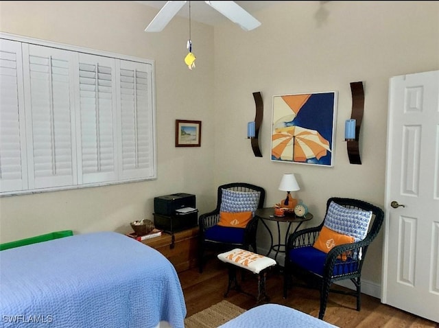 bedroom with hardwood / wood-style flooring and ceiling fan