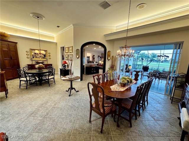 dining area featuring a chandelier and ornamental molding