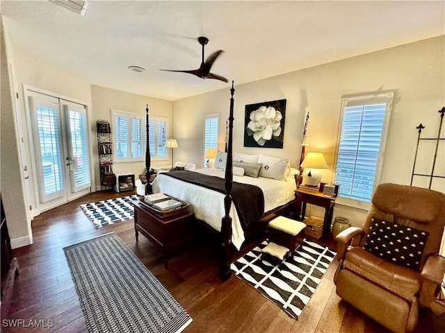 bedroom with french doors, access to outside, dark hardwood / wood-style floors, and ceiling fan