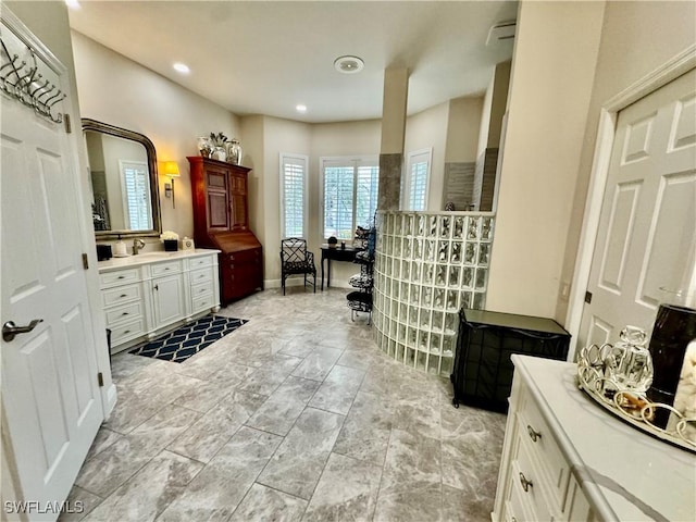 bathroom with vanity and walk in shower