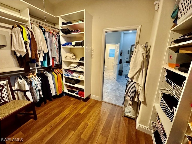 spacious closet featuring hardwood / wood-style floors