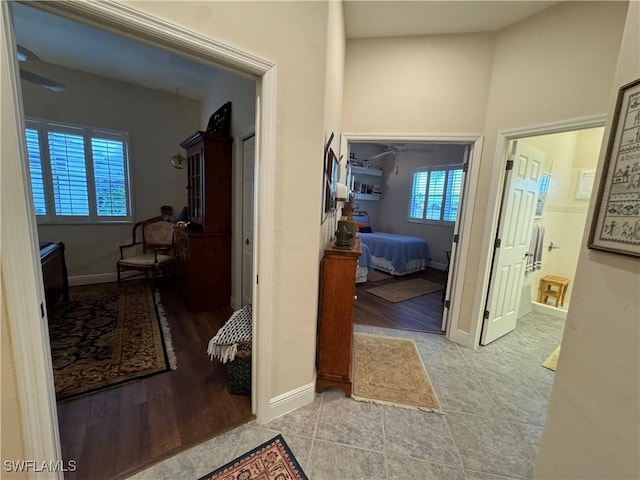 hallway featuring light tile patterned flooring