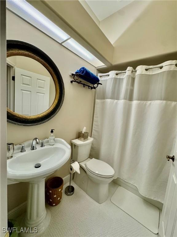 bathroom featuring tile patterned floors and toilet