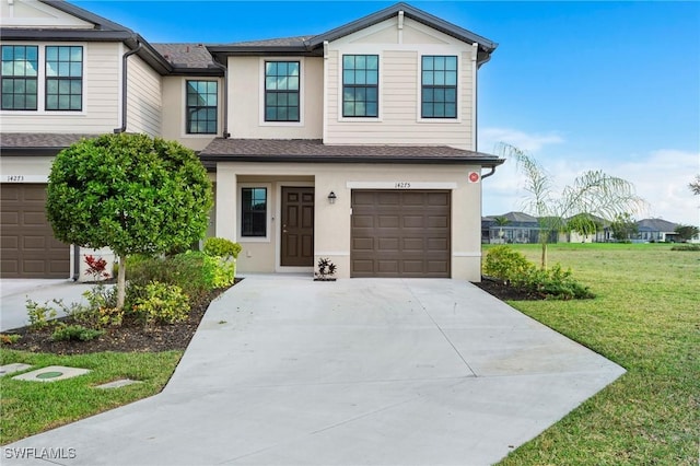 view of front of home with a garage and a front yard