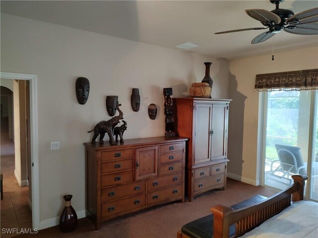 bedroom featuring arched walkways, light carpet, a ceiling fan, baseboards, and access to outside