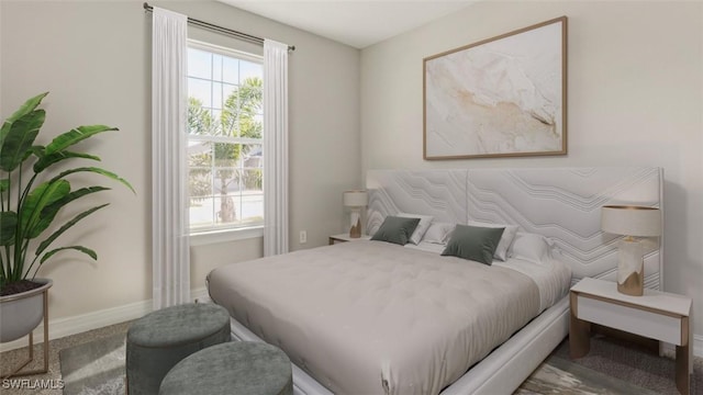 bedroom featuring baseboards