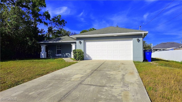 single story home featuring a garage and a front lawn