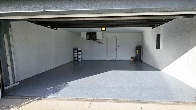 garage with electric panel and electric water heater