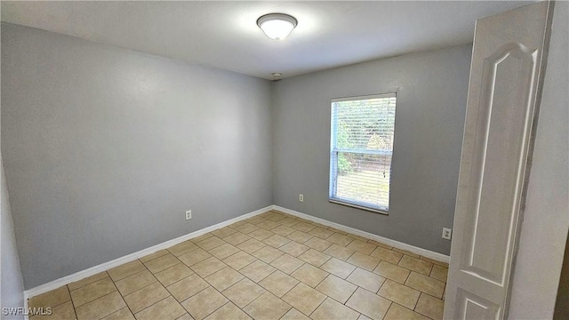 empty room with light tile patterned floors