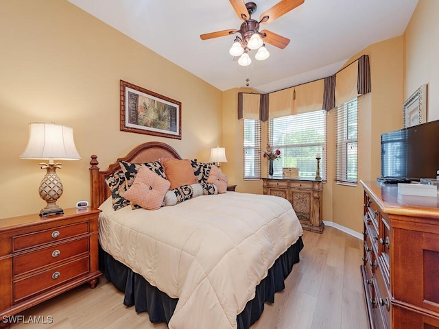 bedroom featuring light hardwood / wood-style flooring and ceiling fan
