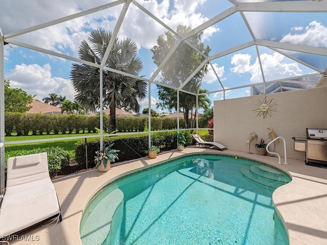 view of pool featuring a patio and a lanai