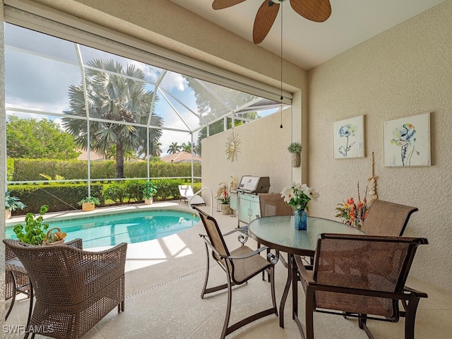 view of swimming pool featuring glass enclosure and a patio