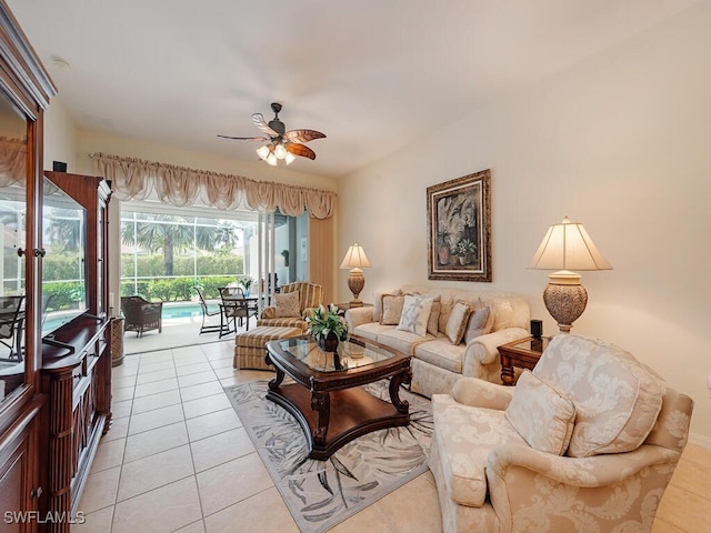 living room with ceiling fan and light tile patterned flooring