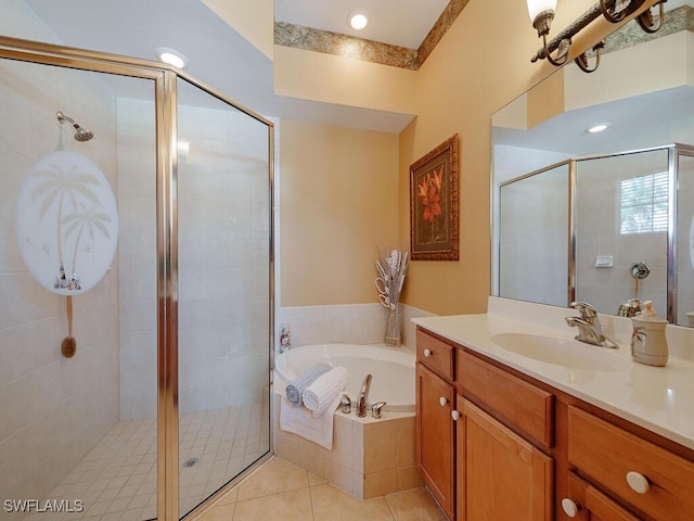 bathroom featuring tile patterned floors, plus walk in shower, and vanity