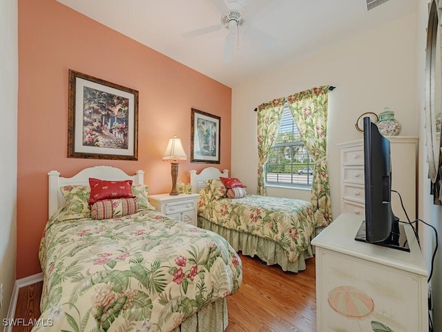 bedroom featuring light hardwood / wood-style floors and ceiling fan
