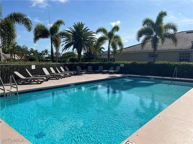 view of swimming pool featuring a patio