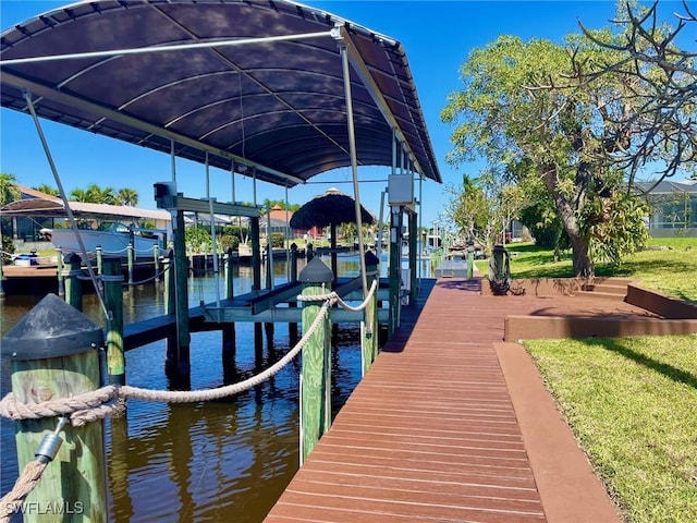 view of dock featuring a water view and boat lift