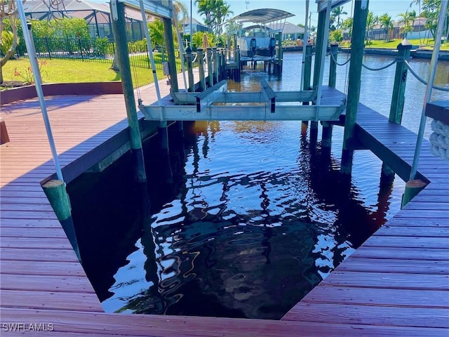 view of dock with a water view and boat lift