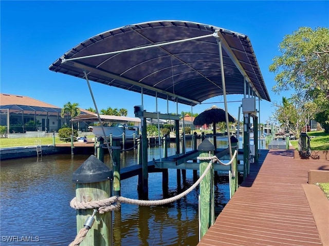 view of dock with a water view and boat lift