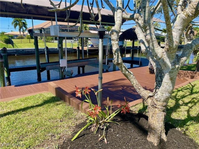 view of dock with a water view and boat lift