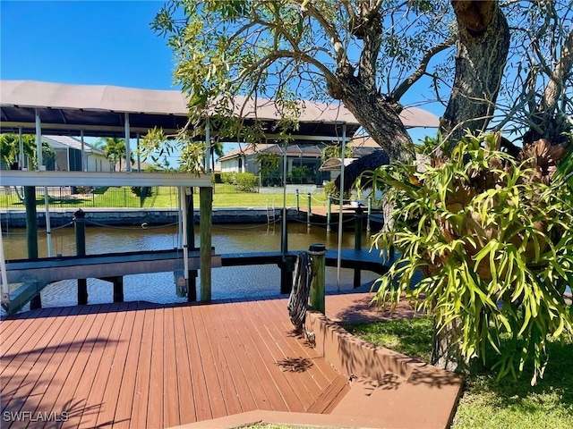 dock area featuring a water view and boat lift