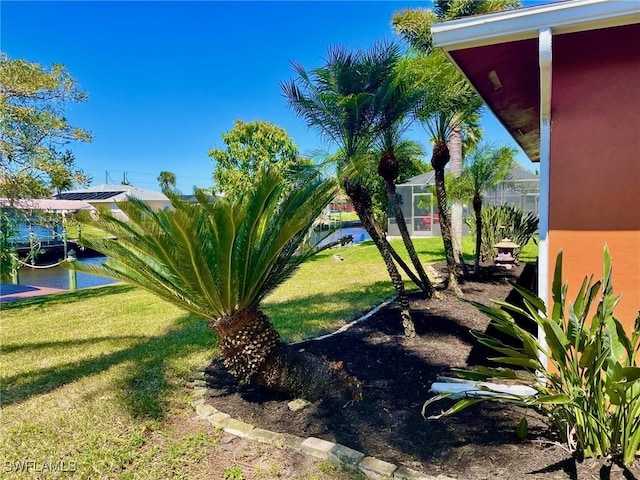 view of yard with a lanai