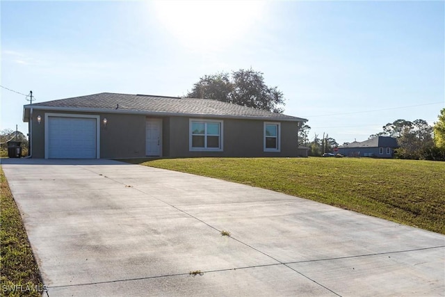 ranch-style house with a garage and a front lawn