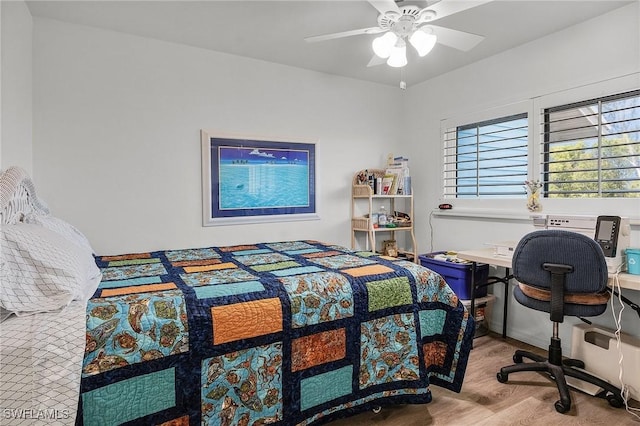 bedroom with ceiling fan and light wood-type flooring