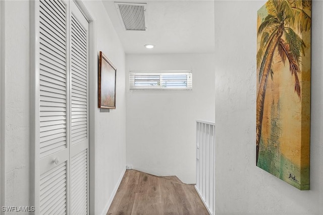 corridor featuring light hardwood / wood-style floors