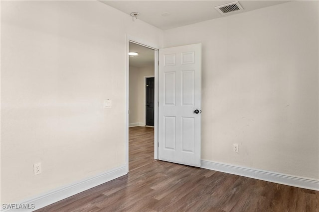 empty room featuring hardwood / wood-style flooring