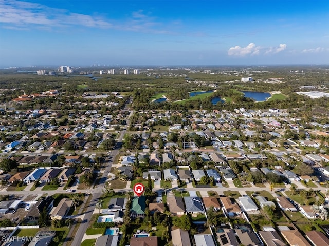 704 107th Ave N, Naples, FL 34108 - aerial overview of property's location featuring a nearby body of water and nearby suburban area
