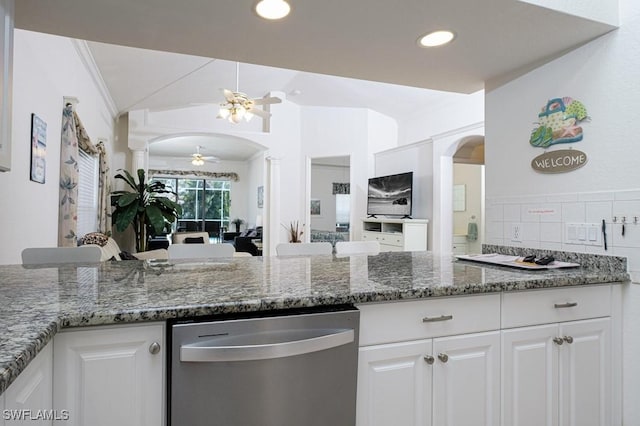 704 107th Ave N, Naples, FL 34108 - kitchen featuring stainless steel dishwasher, ceiling fan, arched walkways, white cabinets, and dark stone counters