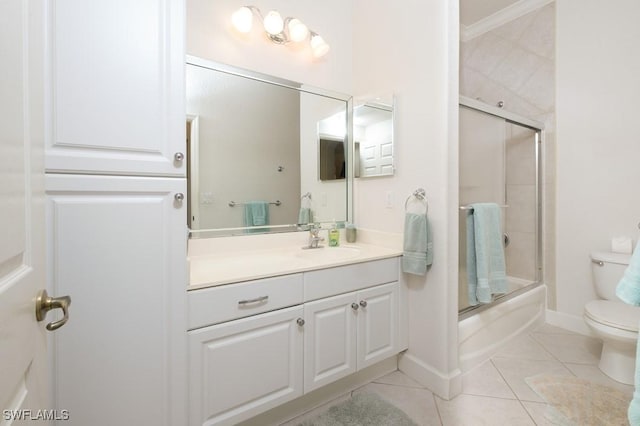 704 107th Ave N, Naples, FL 34108 - bathroom with toilet, vanity, tile patterned flooring, enclosed tub / shower combo, and baseboards