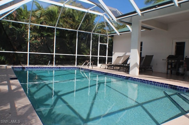 704 107th Ave N, Naples, FL 34108 - swimming pool with a lanai, a patio, and area for grilling