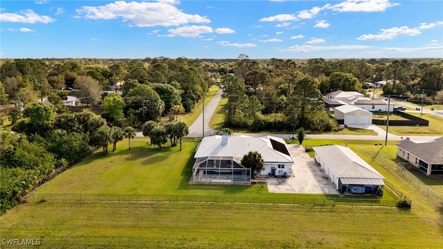 bird's eye view with a wooded view