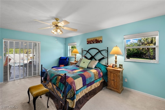 bedroom featuring ceiling fan, carpet, and baseboards