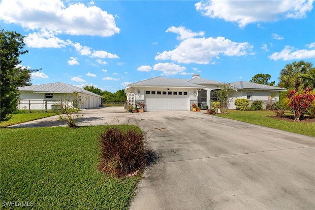 ranch-style house with a garage, fence, a front lawn, and concrete driveway