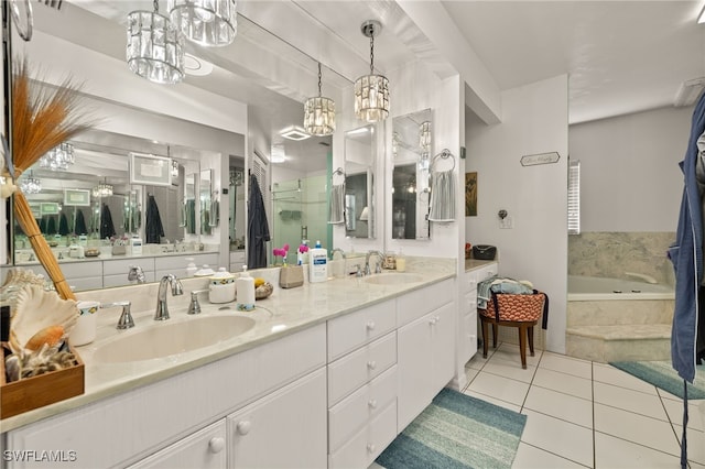 bathroom with a garden tub, double vanity, a sink, and tile patterned floors