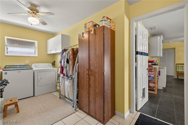 washroom featuring visible vents, light tile patterned floors, cabinet space, and washer and dryer