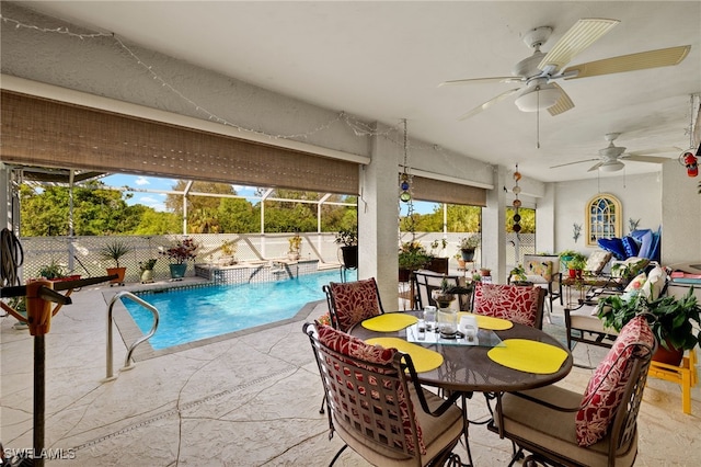 view of swimming pool featuring a fenced in pool, a patio, ceiling fan, a lanai, and a fenced backyard