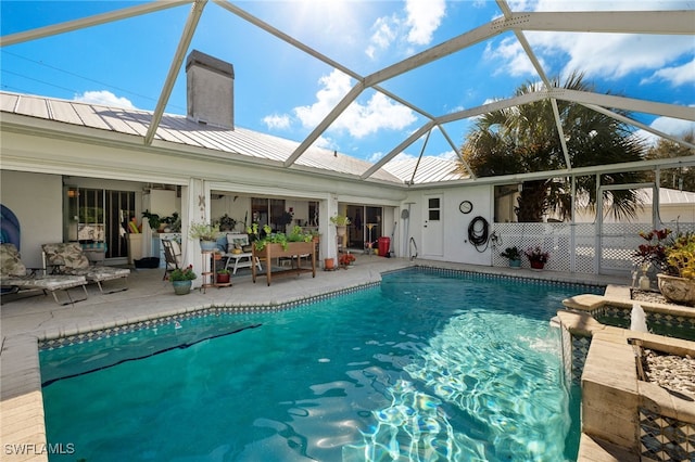 outdoor pool featuring a lanai and a patio