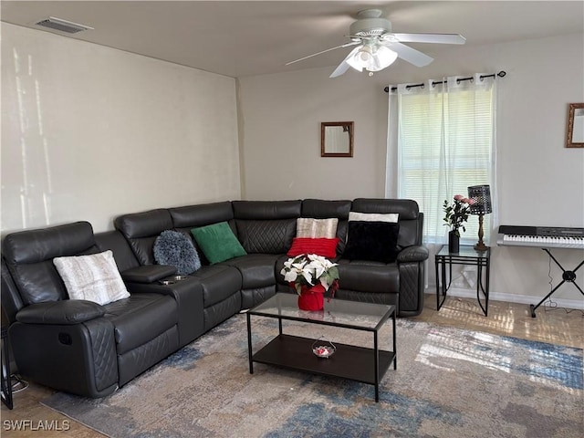 living room with ceiling fan